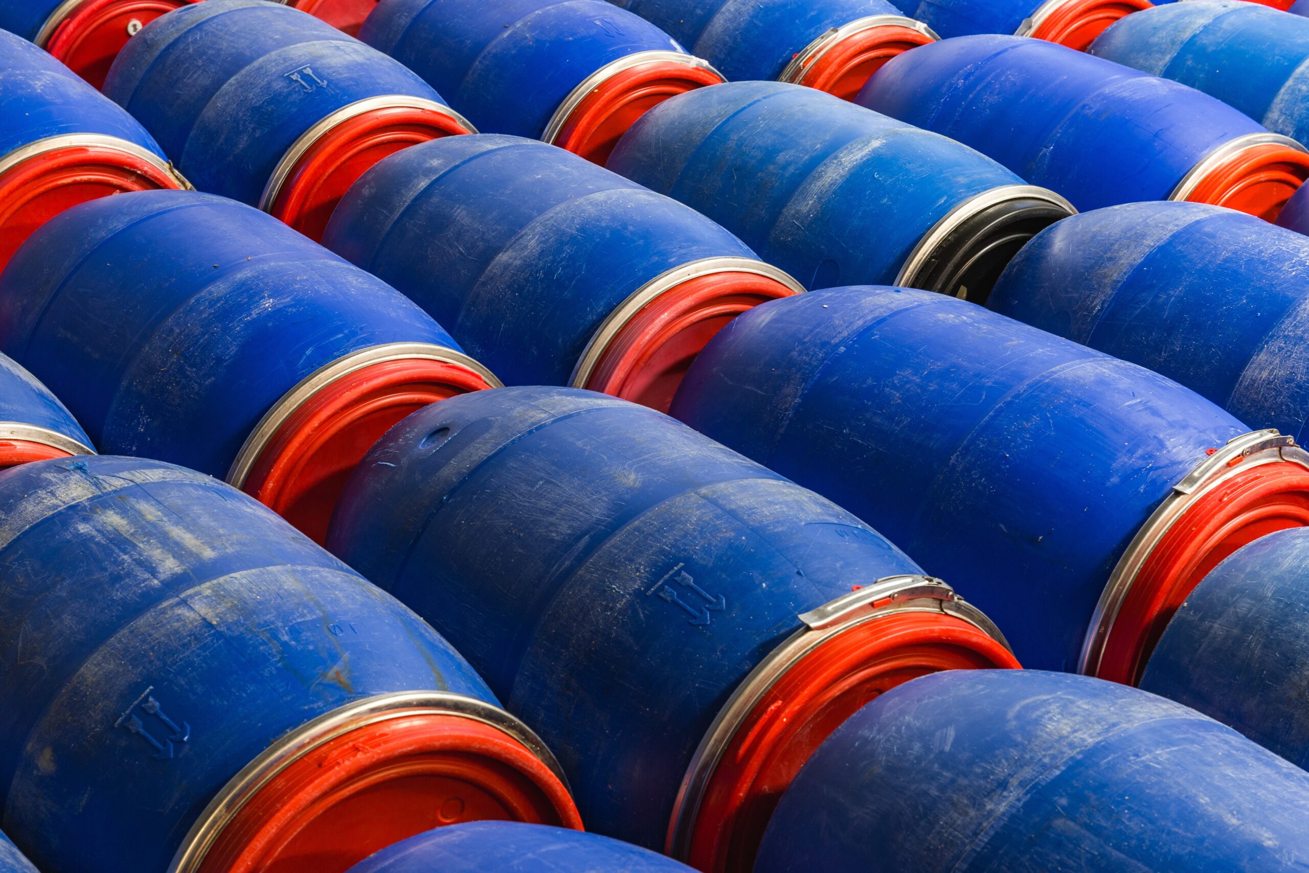 Closeup shot of blue barrels in the factory